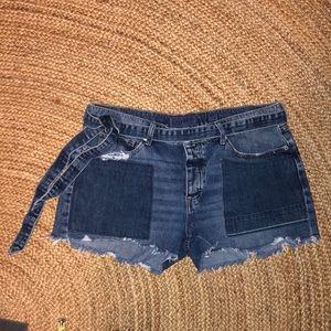 Lucky Brand jean shorts with self-belt and patched pockets.